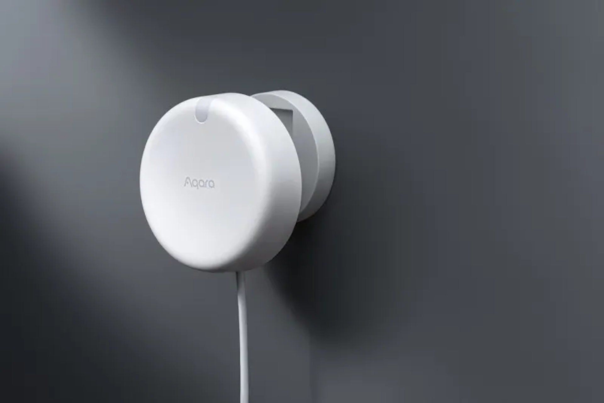 Aqara FP2 presence sensor on a wall.