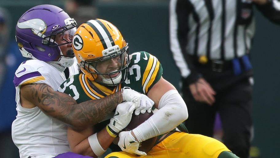 Green Bay Packers safety Evan Williams (33) intercepts a pass intended fo Minnesota Vikings wide receiver Jalen Nailor.