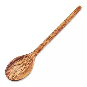 Wooden spoon with a smooth, marbled grain pattern, ideal for cooking or serving