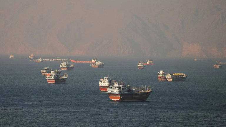 Vessels at the Strait of Hormuz, as seen from Musandam, Oman, on June 15. - Stringer/Reuters