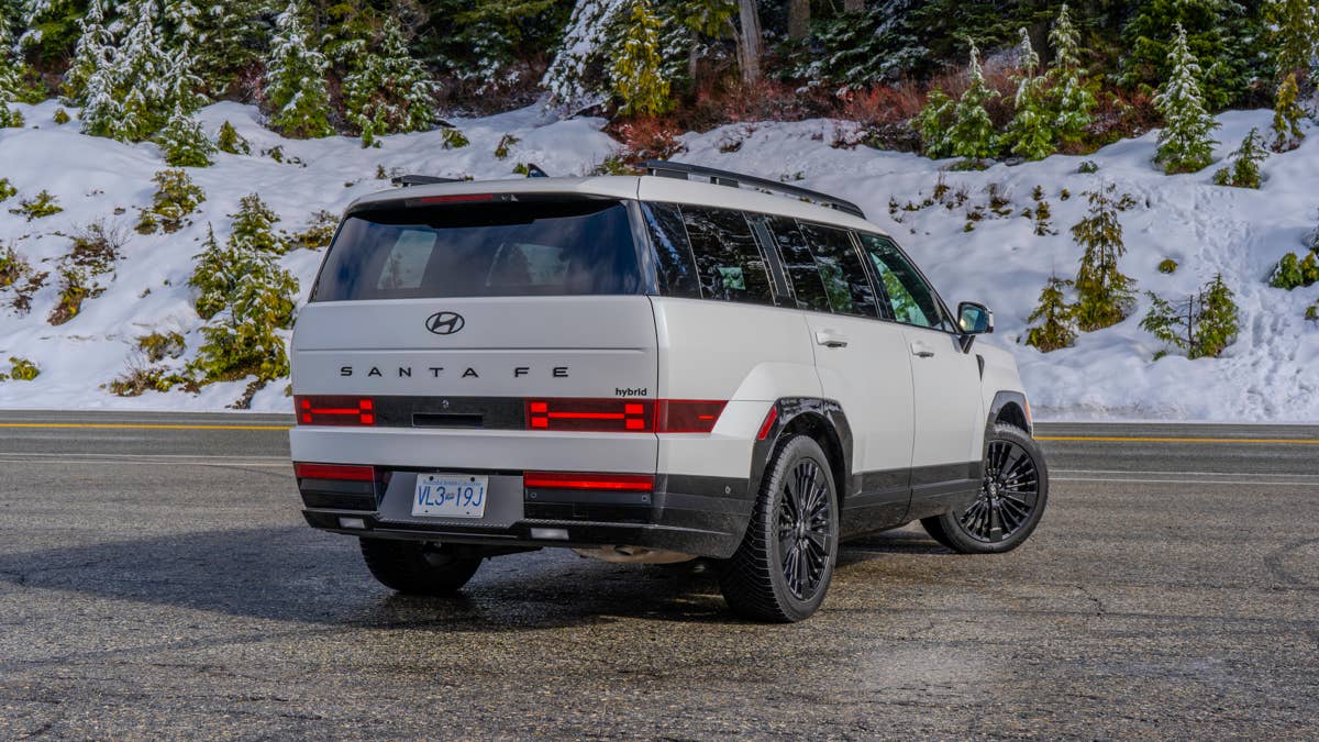 2026-hyundai-santa-fe-hev-calligraphy-in-serenity-white-rear-angled-view