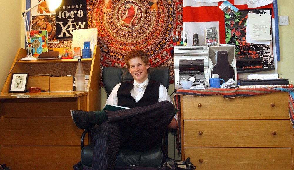 ETON, UNITED KINGDOM - JUNE 06: Prince Harry Sits In His Bedroom At Eton College. Within Limits, Student Are Allowed To Decorate Their Room Themselves. At Typical Student Room He Has A Stereo Music Sound System, Posters And On His Desk A Photograph Of His Mother Diana. This Is One Of A Series Of Picture Released Ahead Of The Prince Completing His Studies At Eton Boarding School. (Photo by Tim Graham Picture Library/Getty Images)