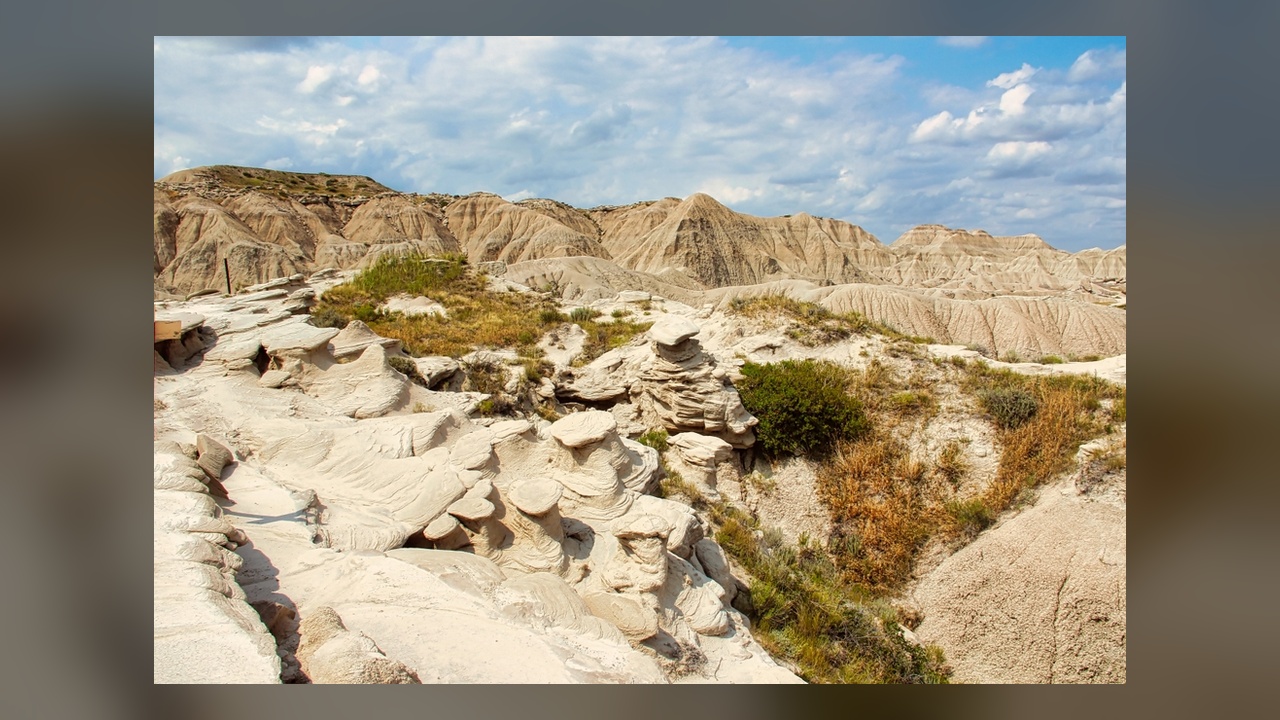 Giant mushroom rocks and prehistoric bones wait at the end of a ...