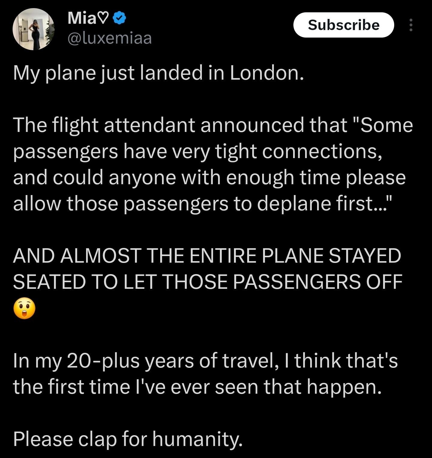 Summary of tweet: A passenger reports that on a flight to London, most stayed seated to let others with tight connections deplane first, showing collective empathy