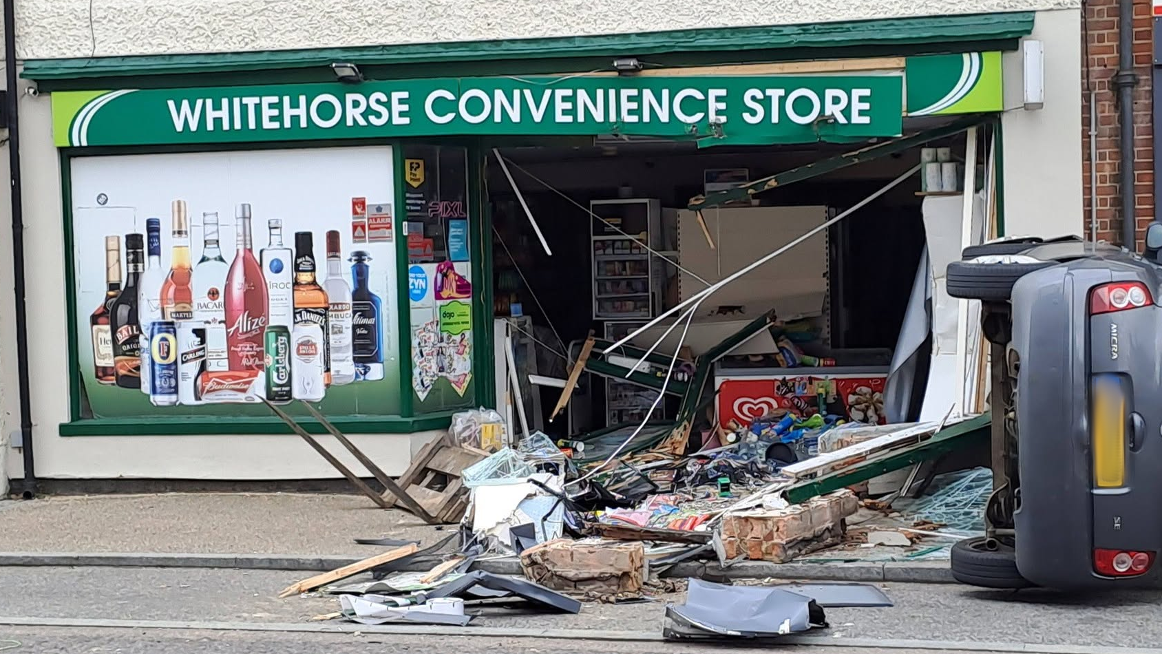 Cash machine ripped out of town store