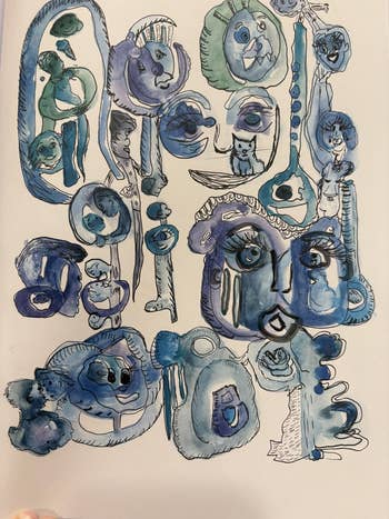 Abstract art with various blue-toned, whimsical faces and shapes filling the canvas, creating a playful and imaginative scene