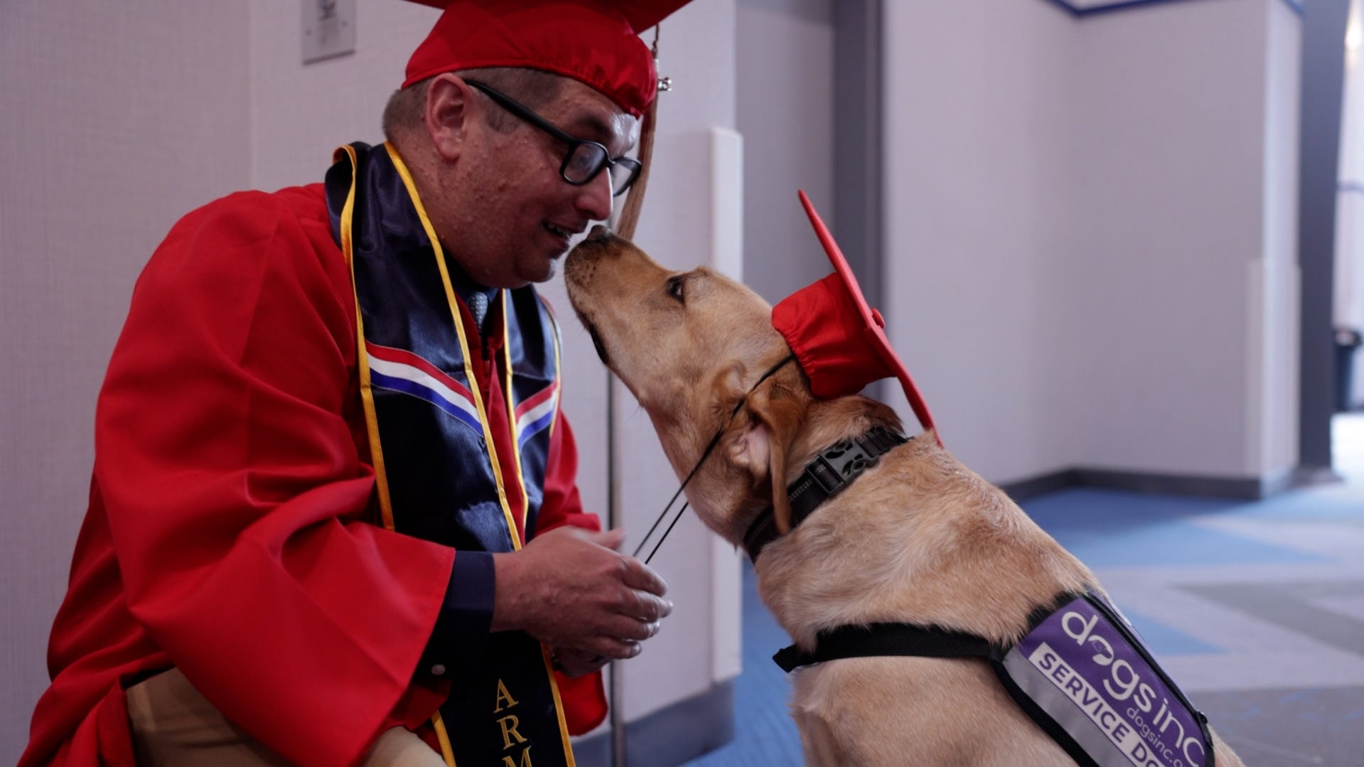 Service dog helps veteran reach graduation day