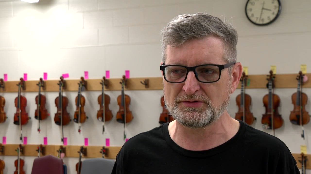 Young students learn orchestra instruments
