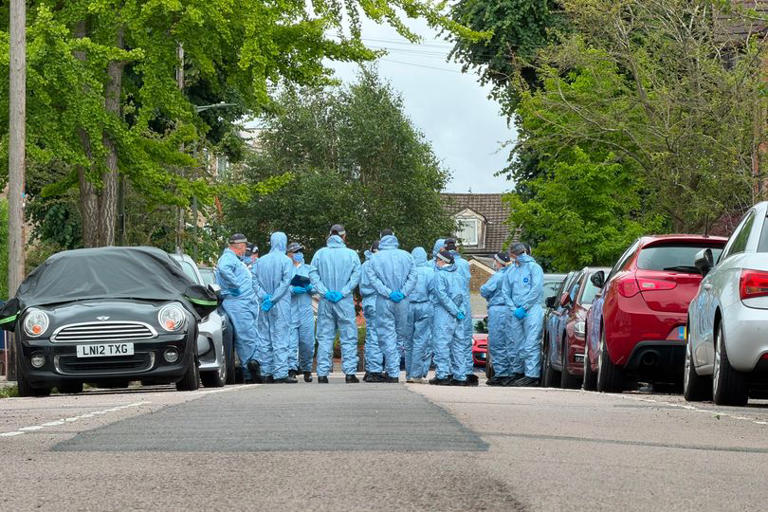 Forensic officers at the scene in Dale Grove, Finchley, after a 19-year-old woman was shot dead on Monday, June 8