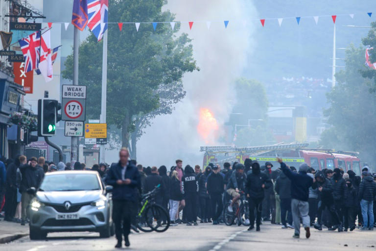 Protesters torch buildings and vehicles, block roads over Belfast stabbing