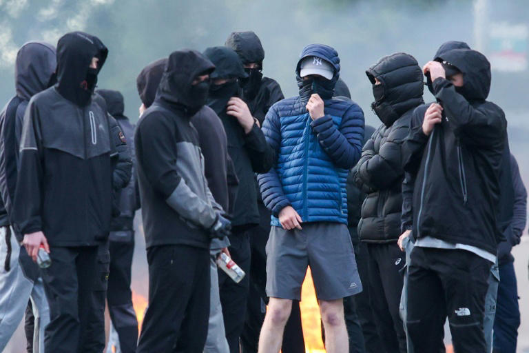 Protesters torch buildings and vehicles, block roads over Belfast stabbing