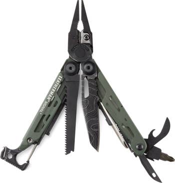 Multi-tool with pliers, saw, knife, and various tools extended with a topo map pattern on a knife tool