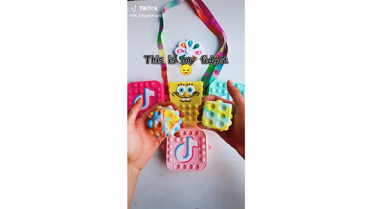 Tapping pink blue and yellow pop it pouches with smooth bubble texture