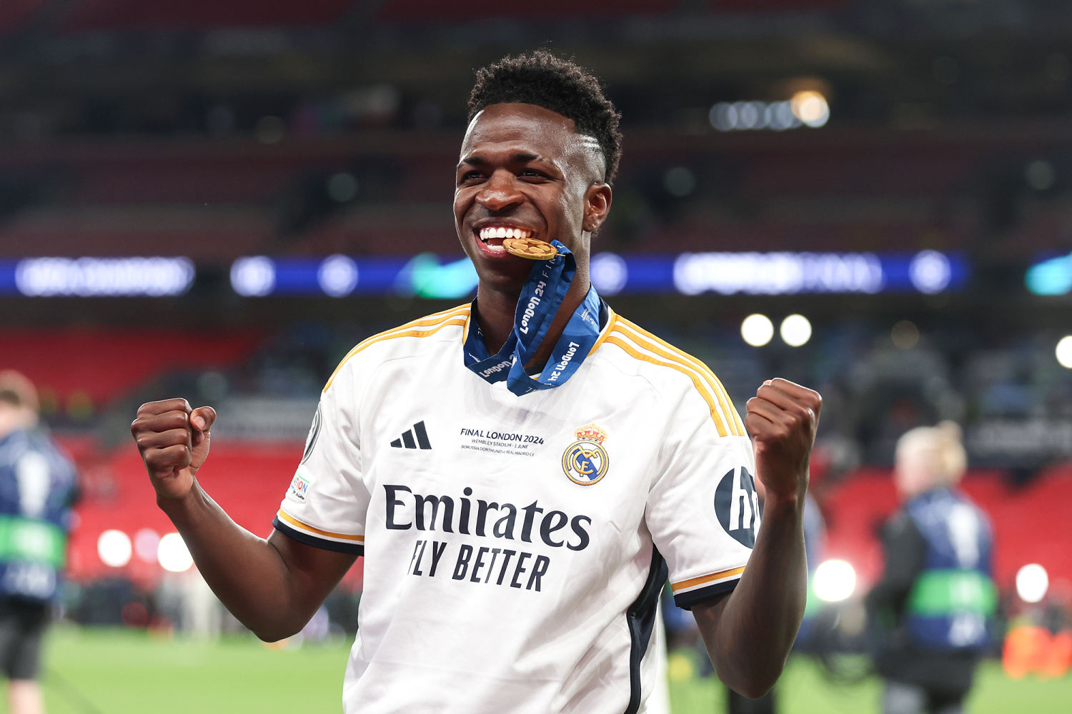 Vinícius Júnior bites his winner's medal after of Real Madrid defeated Borussia Dortmund in the UEFA Champions League final in 2024. (Lars Baron / Getty Images file)