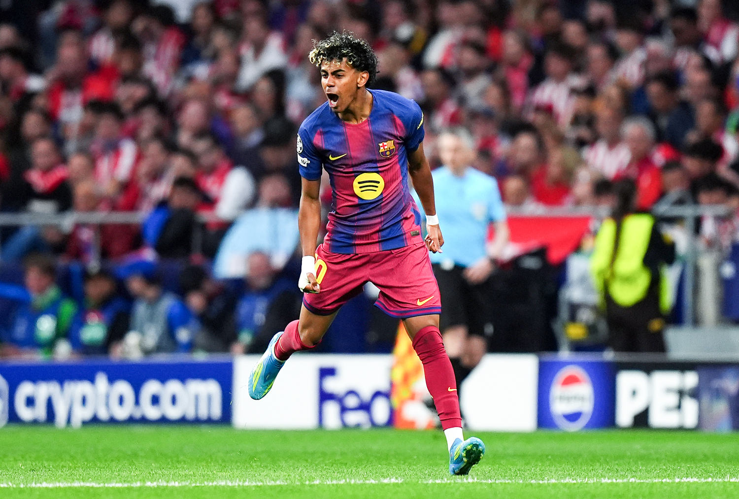 Yamal celebrates scoring Barcelona's first goal in the second leg of its UEFA Champions League quarterfinal against Atlético de Madrid on April 14. (Angel Martinez / Getty Images file)