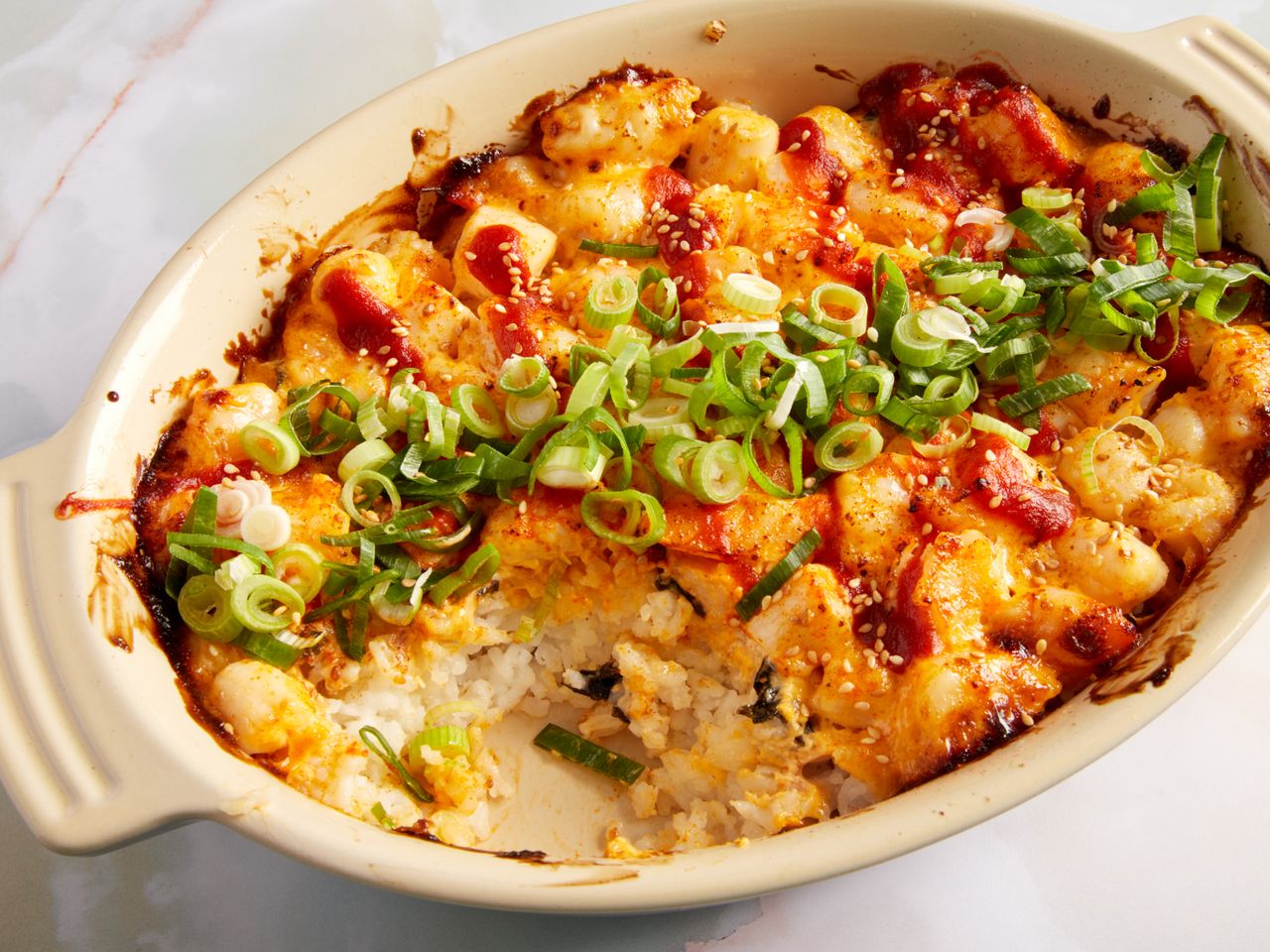 Dynamite rice baked in a oval casserole dish.