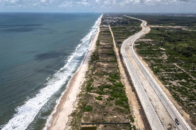 An aerial view of the Lagos-Calabar Coastal Highway along the shoreline in Lekki peninsula in Lagos State on April 17, 2026. (Photo by OLYMPIA DE MAISMONT / AFP via Getty Images)