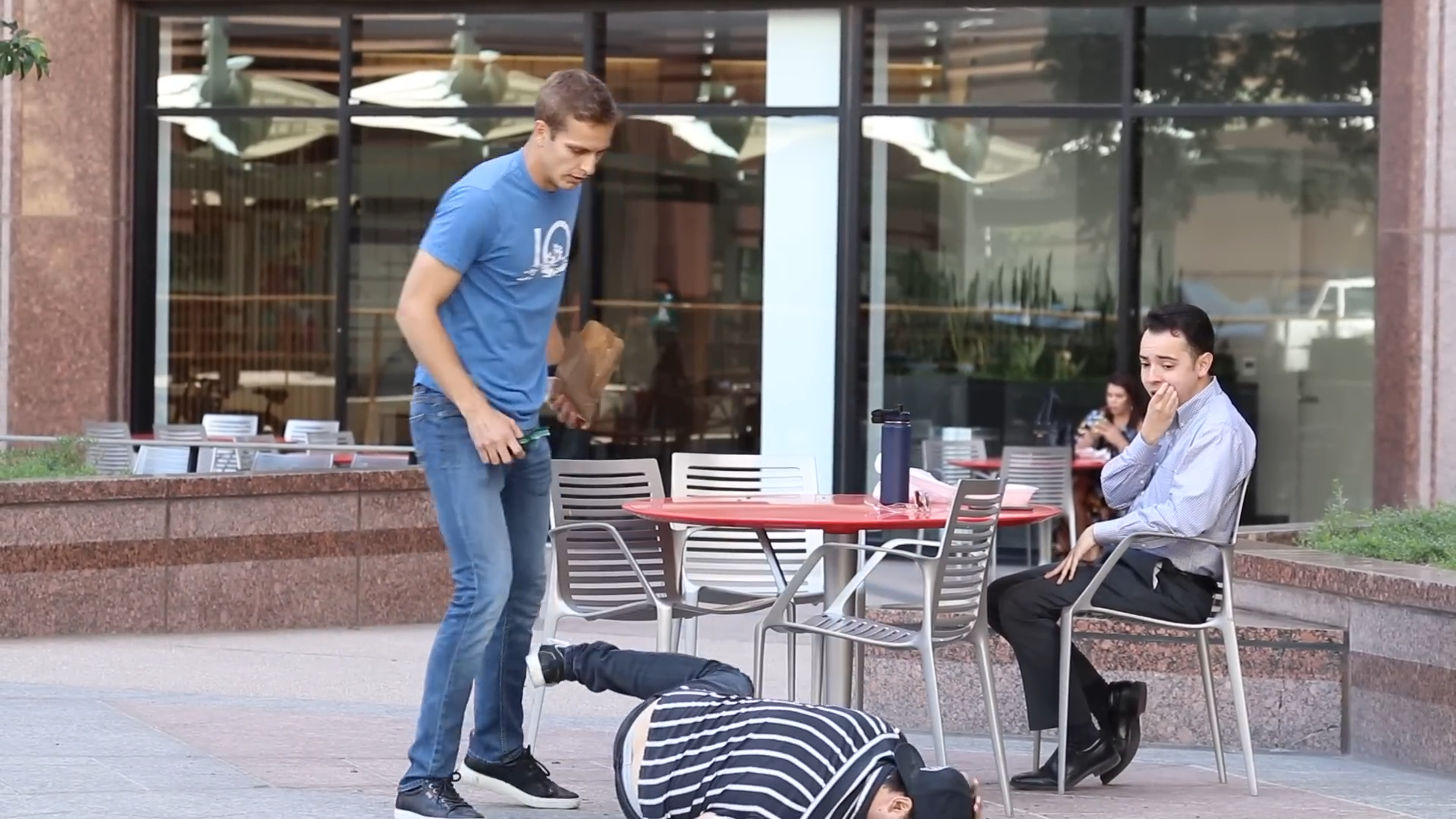 Strangers freeze as man appears to get knocked out in public prank