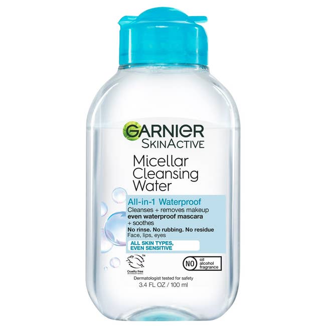 Garnier SkinActive Micellar Cleansing Water in a clear bottle with blue cap, labeled as waterproof and suitable for all skin types, even sensitive
