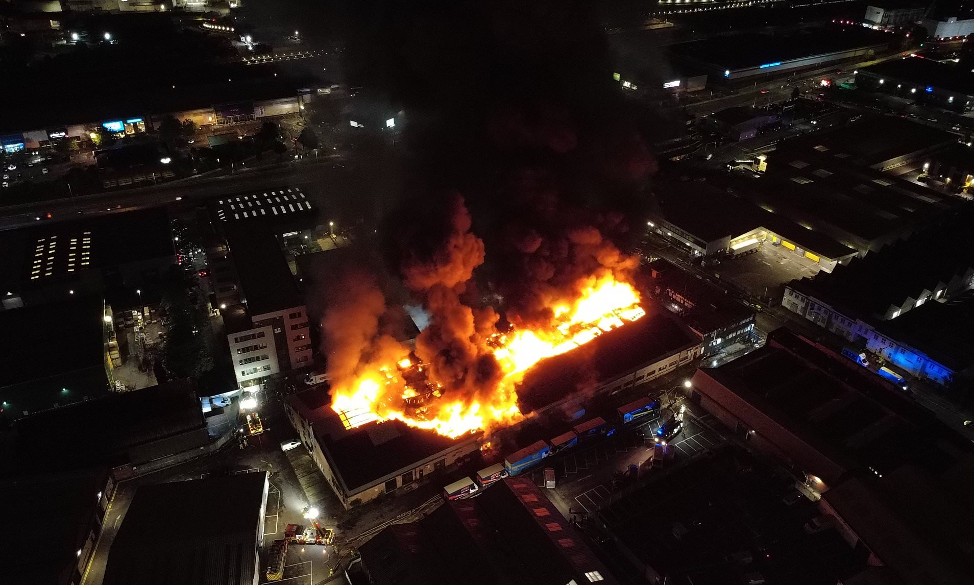 Huge fire erupts at London warehouse as 150 firefighters rush to tackle ...