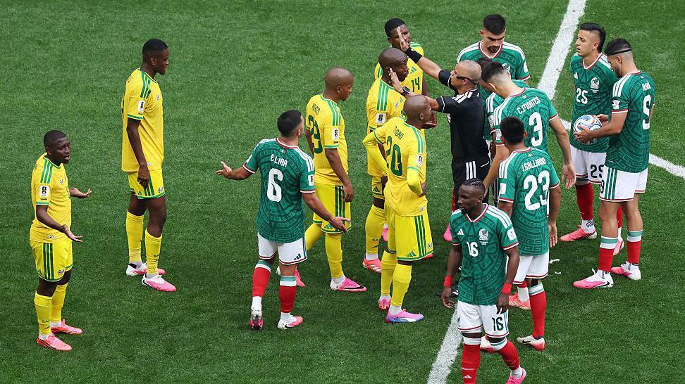 Why are footballers wearing pink boots at the World Cup?