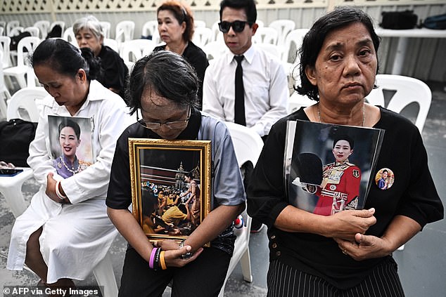 Mourners hold photos of Thai princess Bajrakitiyabha Mahidol inside Chulalongkorn Hospital in Bangkok on June 12