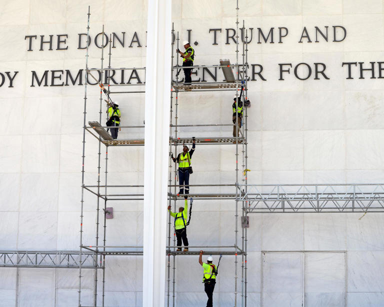 Preparation on 12 June for the removal of Trump’s name from the John F Kennedy Center for the Performing Arts. Photograph: Cliff Owen/AP