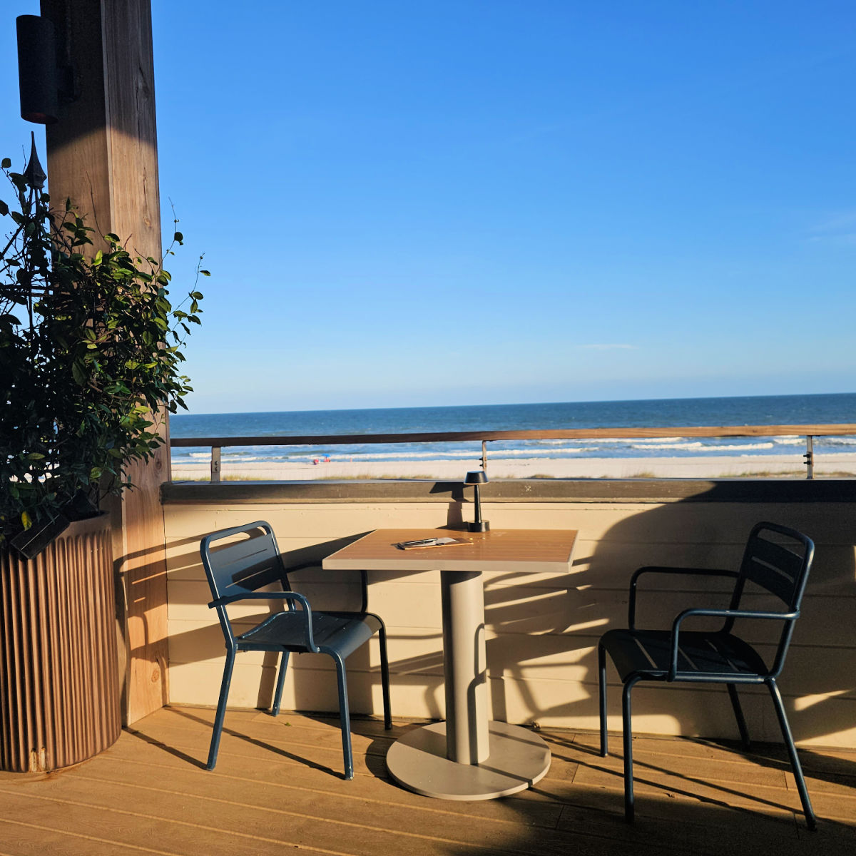 Outside seating at Perch with epic Gulf views