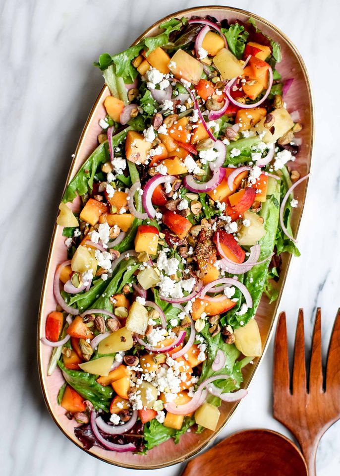 A farmers market salad on a platter with fresh ingredients
