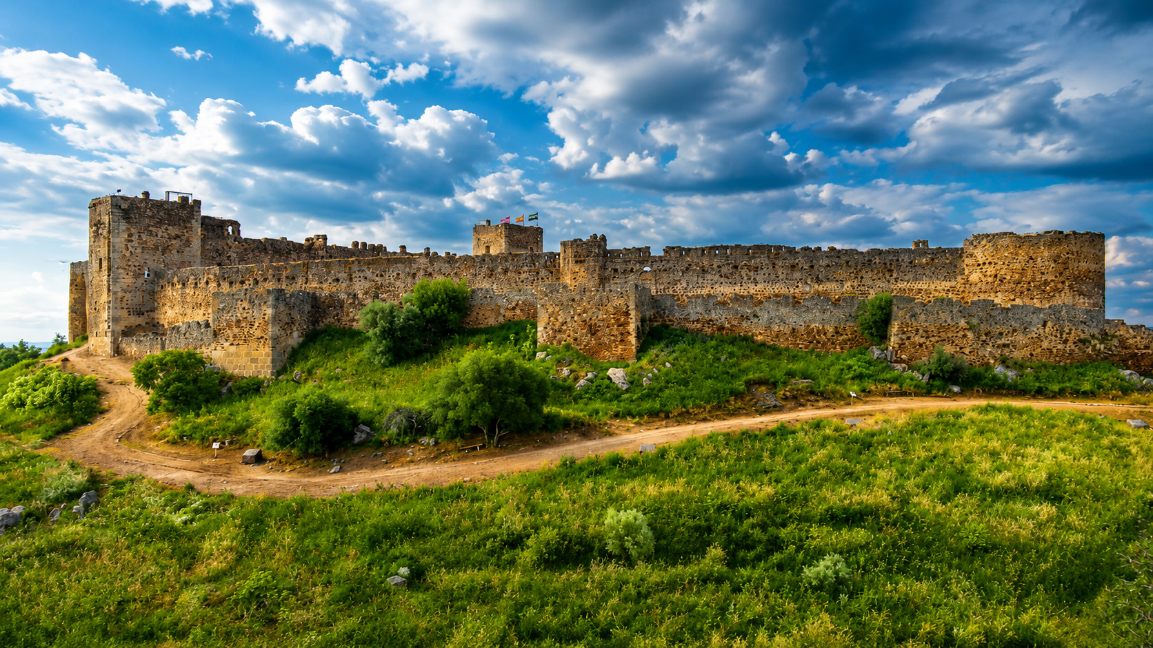 Medellín Castle rising above the Guadiana River valley