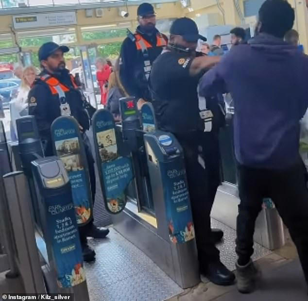 The fare dodger is stopped by a revenue inspector who pushes him back into the station