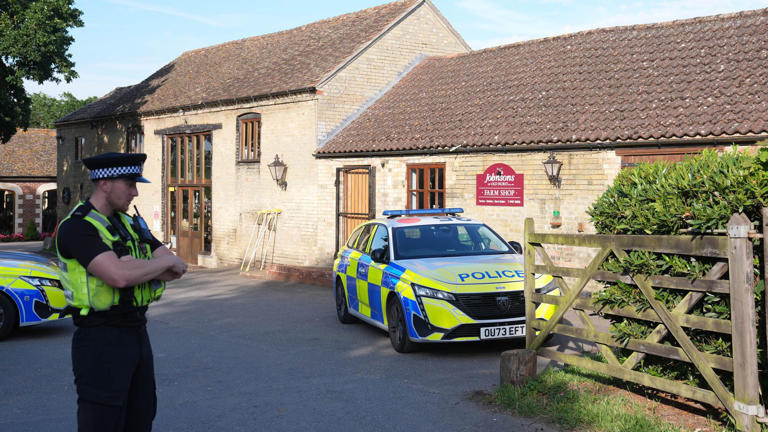 Police at Johnsons of Old Hurst after the incident last week. Pic: PA