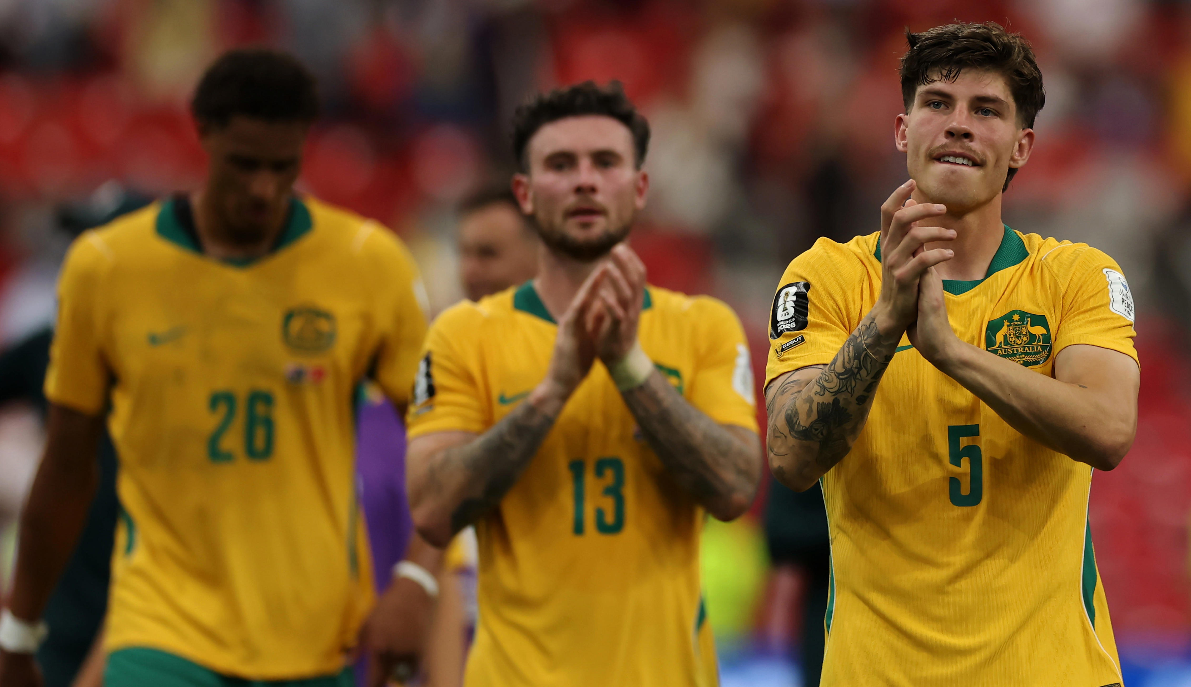 Why does Australia wear yellow and green as its team colors?