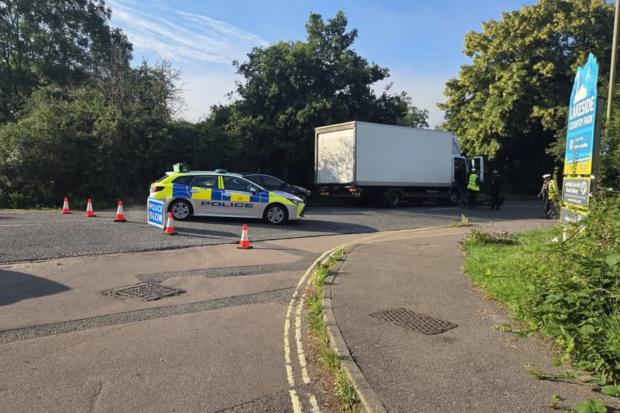 Man seriously injured and road closed after two-van crash