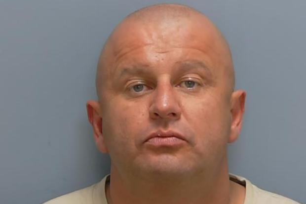 Man jailed for firearm offences after pistol found in storage container