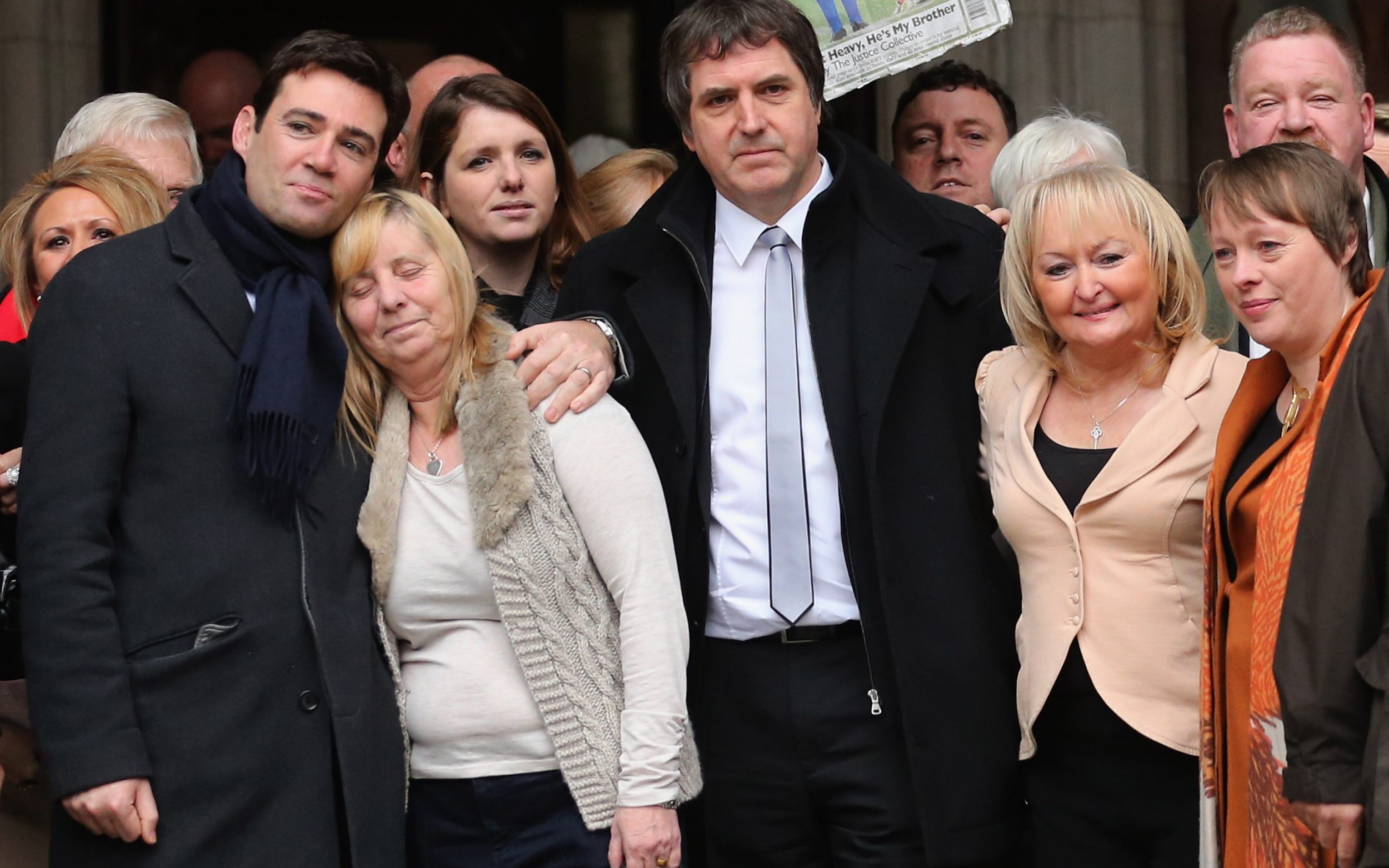 Andy Burnham with Margaret Aspinall, MP Steve Rotheram, Jenni Hicks and other members of families who lost relatives in the Hillsborough disaster outside the High Court in Dec 2012