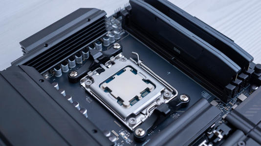 A close-up of a desktop CPU installed in a motherboard socket beside memory slots on a generic black motherboard.