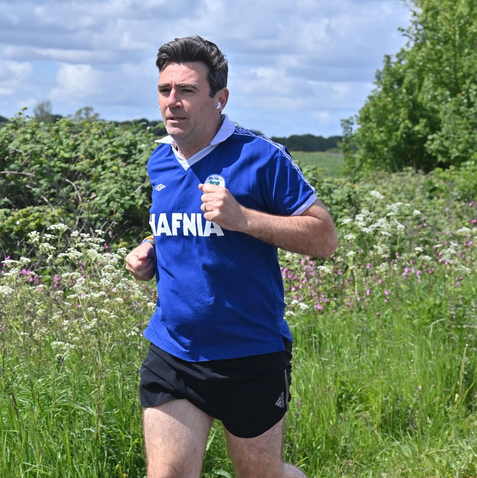 Burnham has shown his credentials as an Everton fan when running, donning a retro football shirt from the 1979/80 season