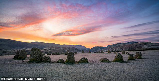 People gather at Castlerigg Stone Circle to celebrate the solstice