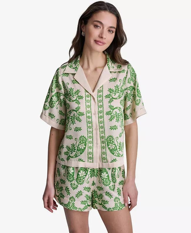 Person wearing a matching short-sleeve shirt and shorts with intricate leaf patterns