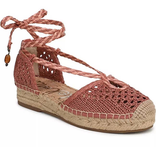 Espadrille sandal with woven design, ankle tie, and a small bead accent on the lace