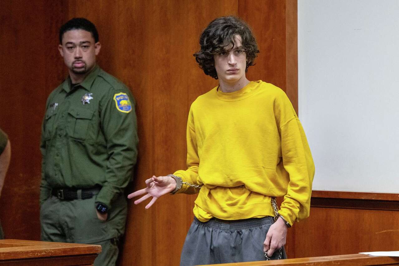 California library shooting suspect flashes apparent white power sign ...