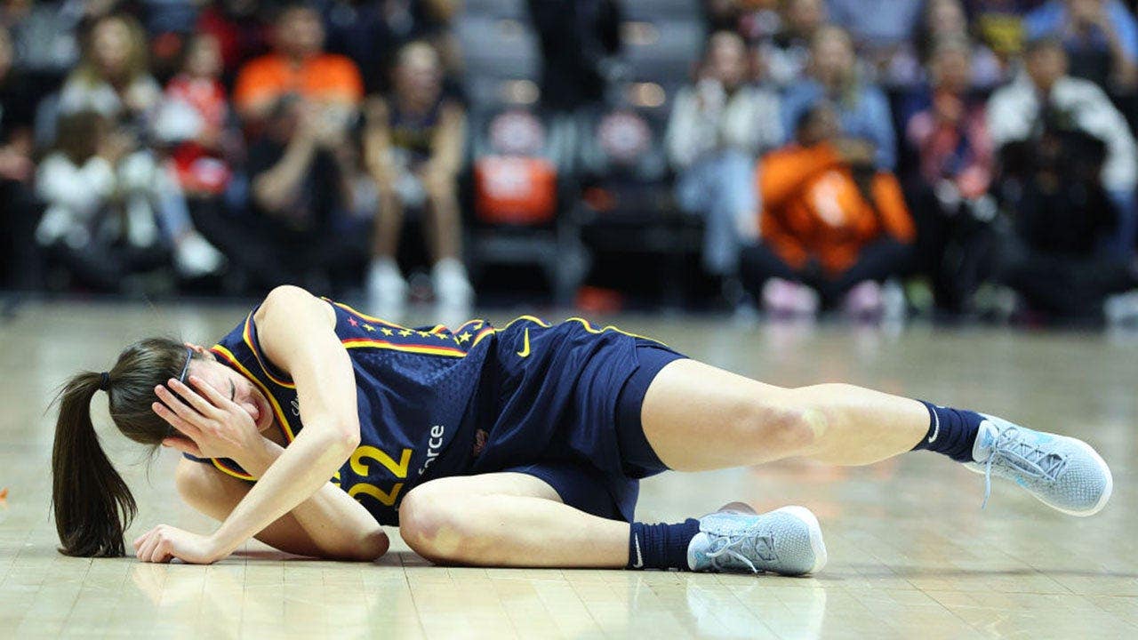 Indiana Fever guard Caitlin Clark reacts after getting hit in the eye during the first round of the 2024 WNBA playoffs against the Connecticut Sun at Mohegan Sun Arena in Uncasville, Conn., on Sept. 22, 2024.