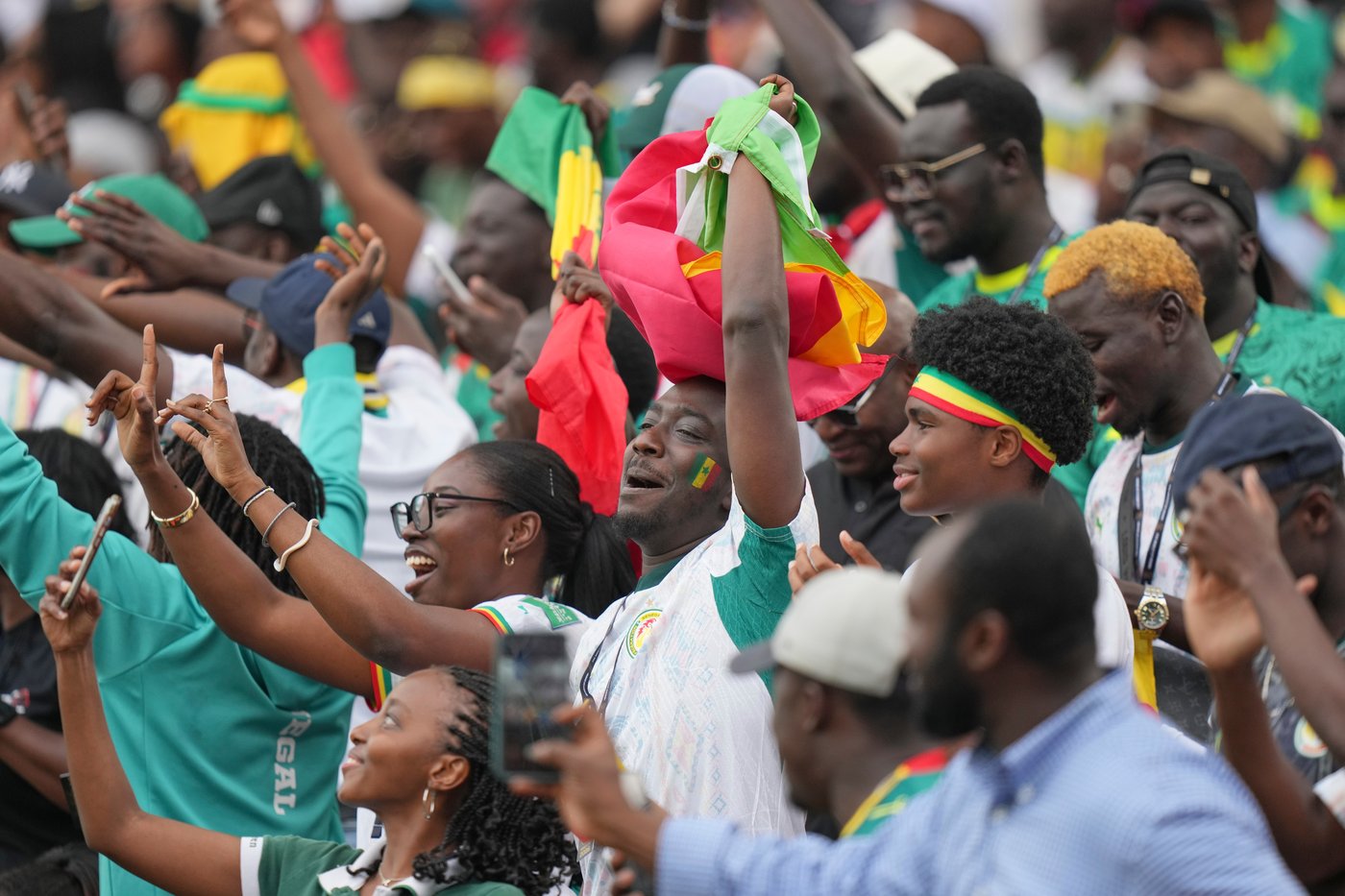 Senegal supporters cheer during the World Cup Group I soccer match between Senegal and Iraq in Toronto, Friday, June 26, 2026. (AP Photo/Stephanie Scarbrough)