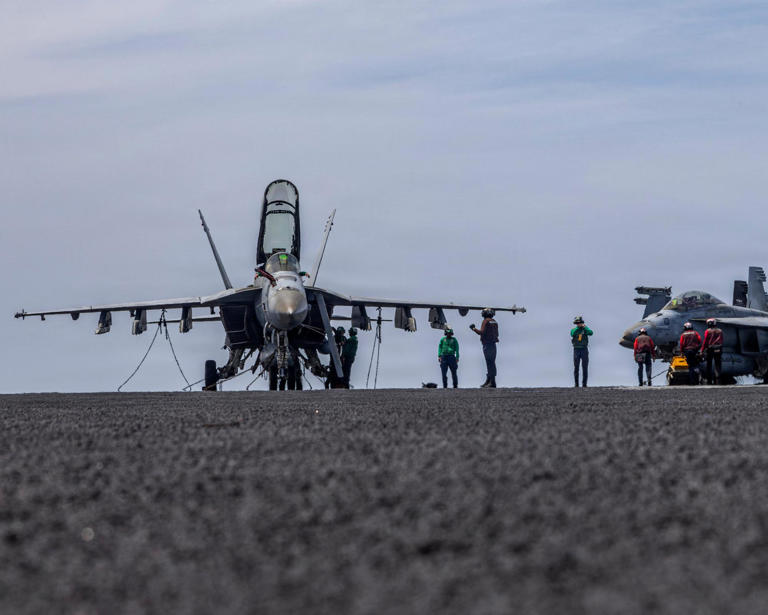 US sailors conducting maintenance on the flight deck of the Nimitz-class aircraft carrier USS Abraham Lincoln (CVN 72) at sea on 15 April 2026.