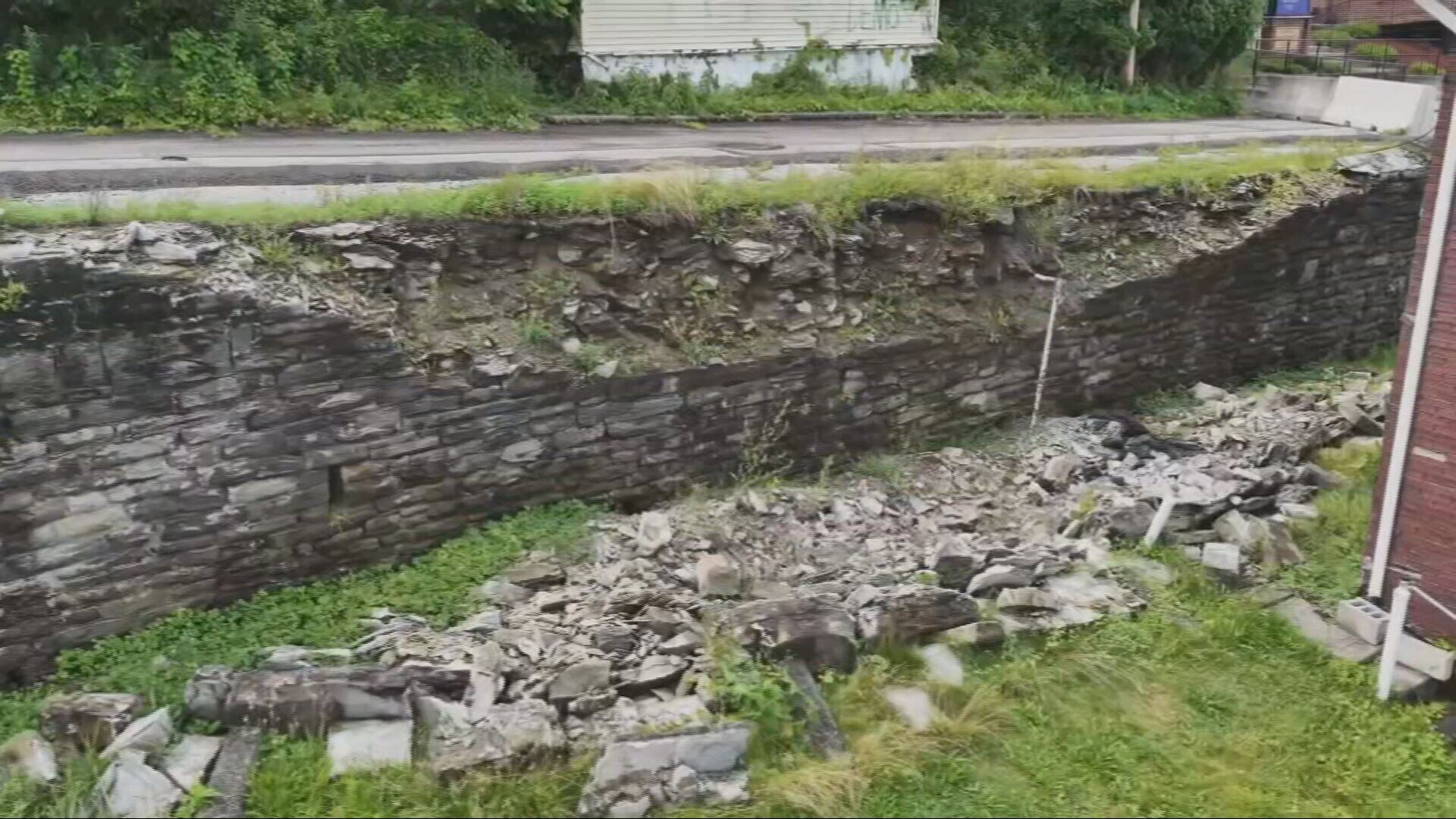 Collapsed retaining wall leaves man isolated from community, officials ...