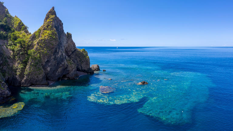 In the Caribbean, this volcanic island with black-sand beaches is one ...