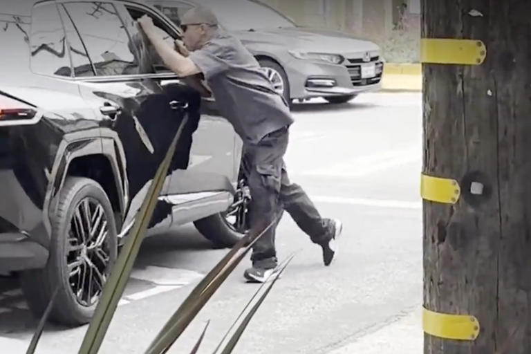 Angry man seen dangling off the side of car in San Francisco road rage ...