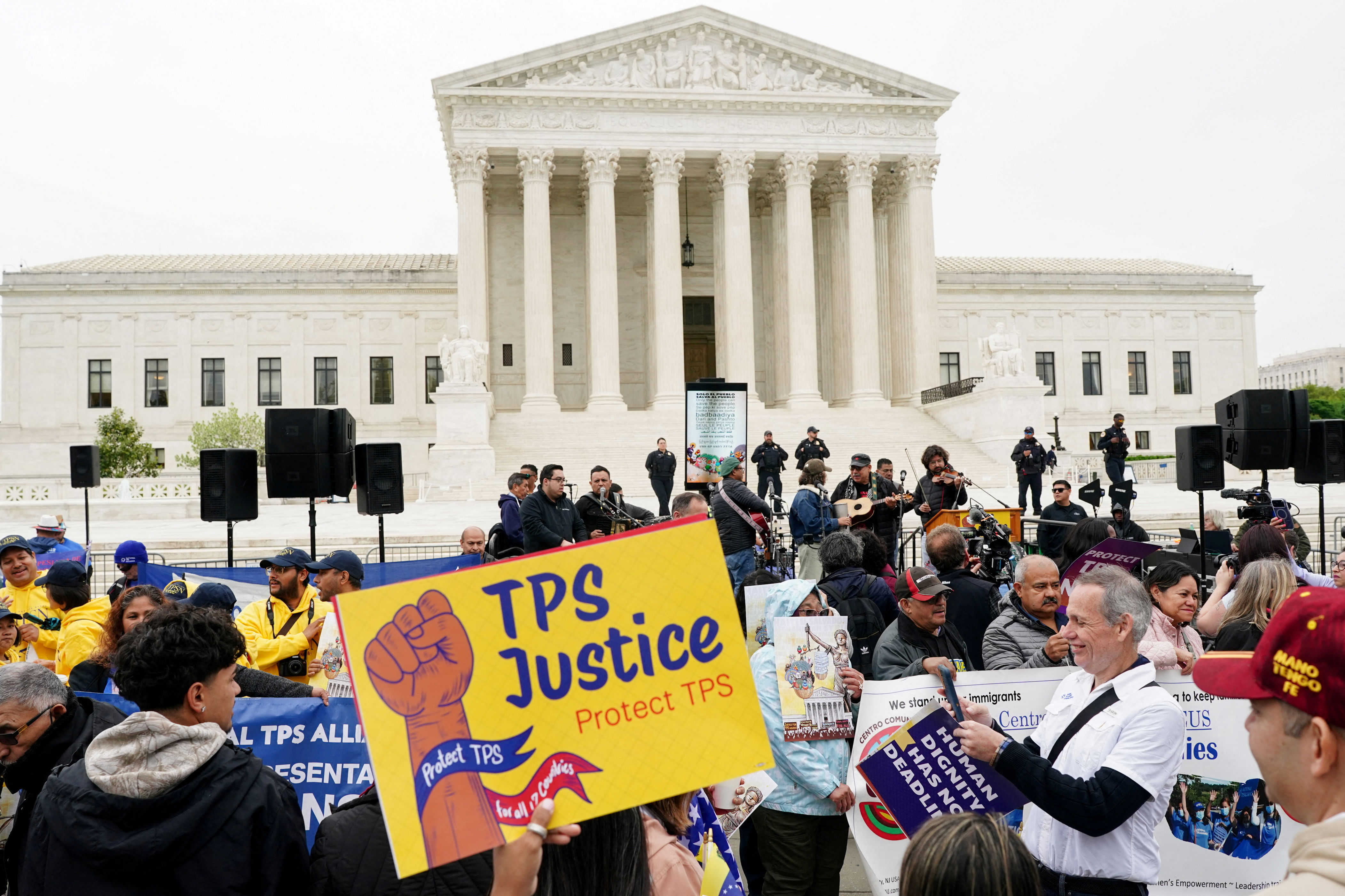 US judge blocks Trump bid to strip work permits from immigrants