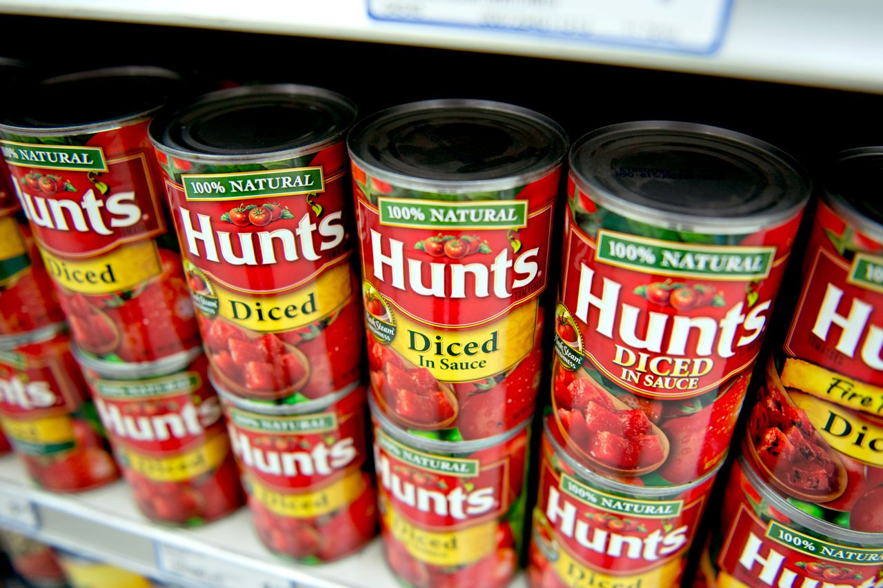 Hunts canned diced tomatoes displayed on a store shelf
